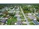 Aerial view of a residential neighborhood, showing houses, pools, and landscaping at 3218 Royal Palm Dr, Edgewater, FL 32141