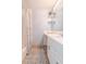 Bathroom with shower/tub combo, white vanity, and tiled floor at 4017 Saxon Dr, New Smyrna Beach, FL 32169