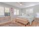 King-size bed, wood floors, and dresser in a well-lit bedroom at 4017 Saxon Dr, New Smyrna Beach, FL 32169