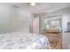 Bedroom with mirrored closet doors and a queen-size bed at 4017 Saxon Dr, New Smyrna Beach, FL 32169