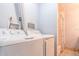 Stackable washer and dryer in a small laundry room at 4017 Saxon Dr, New Smyrna Beach, FL 32169