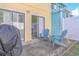 Small patio with seating area and grill, perfect for outdoor dining at 4017 Saxon Dr, New Smyrna Beach, FL 32169