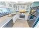 Well-equipped kitchen featuring white appliances and light countertops at 4590 S Atlantic Ave # 263, Ponce Inlet, FL 32127