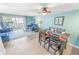 Bright dining area with table and chairs, adjacent to living room at 4590 S Atlantic Ave # 263, Ponce Inlet, FL 32127