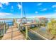 Wooden dock with a sailboat and waterfront views at 4590 S Atlantic Ave # 263, Ponce Inlet, FL 32127