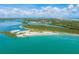 Aerial view of coastline with lighthouse and marina at 4590 S Atlantic Ave # 263, Ponce Inlet, FL 32127