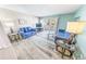 Living room boasts a comfy seating area and large windows at 4590 S Atlantic Ave # 263, Ponce Inlet, FL 32127