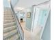 Staircase leading to the second floor with carpet at 4590 S Atlantic Ave # 263, Ponce Inlet, FL 32127