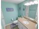 Clean bathroom with light teal walls and updated vanity at 4590 S Atlantic Ave # 263, Ponce Inlet, FL 32127