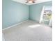 Light and airy bedroom with a ceiling fan and window at 4590 S Atlantic Ave # 263, Ponce Inlet, FL 32127