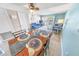 Bright dining area with wood table and blue accents at 4590 S Atlantic Ave # 263, Ponce Inlet, FL 32127