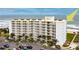 Oceanfront building with parking and picnic tables at 5201 S Atlantic Ave # 809A, New Smyrna Beach, FL 32169