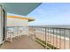 Balcony with ocean views and seating for two at 5201 S Atlantic Ave # 809A, New Smyrna Beach, FL 32169