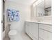 Clean bathroom with white vanity, tile floor, and shower/tub combo at 5201 S Atlantic Ave # 809A, New Smyrna Beach, FL 32169