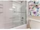 Clean bathroom with a shower/tub combo and tiled walls at 5201 S Atlantic Ave # 809A, New Smyrna Beach, FL 32169