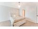 Bedroom with a queen-size bed and access to a bathroom at 5201 S Atlantic Ave # 809A, New Smyrna Beach, FL 32169