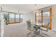 Bright dining area with ocean view and glass table at 5201 S Atlantic Ave # 809A, New Smyrna Beach, FL 32169