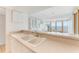 Kitchen with white cabinets and double sink at 5201 S Atlantic Ave # 809A, New Smyrna Beach, FL 32169