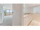 Small kitchenette with white cabinets and ocean views at 5201 S Atlantic Ave # 809A, New Smyrna Beach, FL 32169