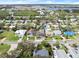Aerial view showcasing home's location, neighborhood, and proximity to waterways at 624 S Pine St, New Smyrna Beach, FL 32169