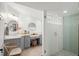 Spa-like bathroom with a walk-in shower and gray vanity at 624 S Pine St, New Smyrna Beach, FL 32169