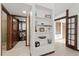 Open shelving and a large walk-in closet with clothing at 624 S Pine St, New Smyrna Beach, FL 32169