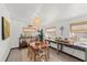 Cozy dining area with a wooden table and wicker chairs at 624 S Pine St, New Smyrna Beach, FL 32169