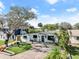 Updated home with landscaped yard and paver driveway at 624 S Pine St, New Smyrna Beach, FL 32169