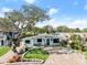 Updated home with landscaped yard and paver driveway at 624 S Pine St, New Smyrna Beach, FL 32169