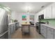 Modern kitchen with stainless steel appliances and a butcher block island at 624 S Pine St, New Smyrna Beach, FL 32169