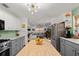 Bright kitchen with stainless steel appliances and a view of the living room at 624 S Pine St, New Smyrna Beach, FL 32169