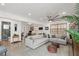 Spacious living room featuring a sectional sofa and a ceiling fan at 624 S Pine St, New Smyrna Beach, FL 32169