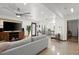 Open concept living room with sectional sofa and view into kitchen at 624 S Pine St, New Smyrna Beach, FL 32169