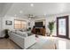 Living room with sectional sofa, wood media console and ceiling fan at 624 S Pine St, New Smyrna Beach, FL 32169