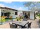 Outdoor patio with dining table and seating area at 624 S Pine St, New Smyrna Beach, FL 32169