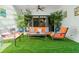 Covered patio features comfortable seating and artificial turf at 624 S Pine St, New Smyrna Beach, FL 32169
