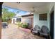 Cozy patio with seating and a ceiling fan at 624 S Pine St, New Smyrna Beach, FL 32169
