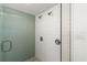 Walk-in shower with subway tile and a green glass accent wall at 624 S Pine St, New Smyrna Beach, FL 32169