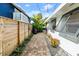 Brick pathway leads through a nicely landscaped side yard at 624 S Pine St, New Smyrna Beach, FL 32169
