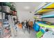 Storage room with shelving, bikes, and paddleboards at 624 S Pine St, New Smyrna Beach, FL 32169