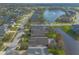 Aerial view of the house and surrounding lake at 6793 Calistoga Cir, Port Orange, FL 32128