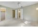 Bright bedroom with multiple doors and closet at 130 Cypress Pond Rd, Port Orange, FL 32128