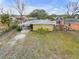 High-angle view of a house with carport and large yard at 130 Indian Creek Rd, Oak Hill, FL 32759