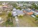 An aerial shot of the property, displaying the home's roof, carport, and yard at 130 Indian Creek Rd, Oak Hill, FL 32759
