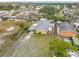 Aerial view of the property and neighboring homes, highlighting the fenced yard at 130 Indian Creek Rd, Oak Hill, FL 32759