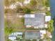Aerial view of property with surrounding homes and canal access at 130 Indian Creek Rd, Oak Hill, FL 32759
