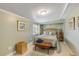 Comfortable bedroom featuring wooden furniture and sea-inspired decorations at 130 Indian Creek Rd, Oak Hill, FL 32759