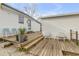Multi-level wooden deck with seating areas and potted plants at 130 Indian Creek Rd, Oak Hill, FL 32759