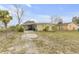Front exterior of a single-Gathering home with a carport and fenced yard at 130 Indian Creek Rd, Oak Hill, FL 32759