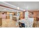 Kitchen and dining area with breakfast bar, wood cabinets, and white appliances at 130 Indian Creek Rd, Oak Hill, FL 32759